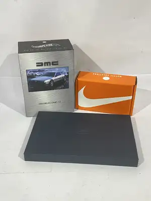 Hot Wheels and similar, a mixed boxed group of modern diecast collectibles and card games, to include Hot Wheels DeLorean DMC-12 (boxed), Hot Wheels DeLorean A