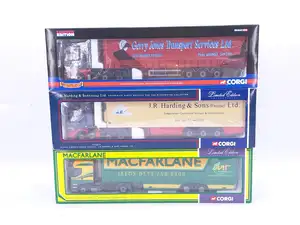 Corgi, a boxed group of 1:50 scale diecast commercial vehicles. Including MAN TGA XXL curtainside “Gerry Jones Transport Services Ltd”, Scania 4 Series fri