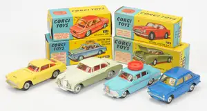 Corgi Toys A Group of 4 - (1) 218 Aston martin DB4 - Yellow body, red interior, silver trim, Criss-Cross cast hubs