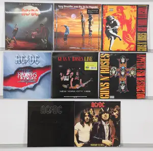 New Vinyl: A selection of hard rock and heavy metal vinyl LPs featuring iconic studio albums and live recordings from AC/DC and Guns N' Roses. The collection i